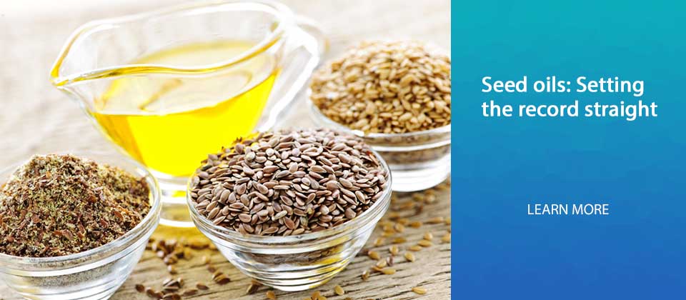Bowls of whole and ground flax seed with linseed oil