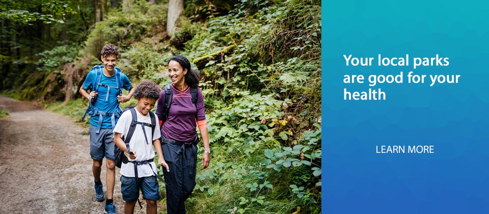 Family hiking on wooded trail
