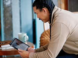 Patient using tablet for virtual visit
