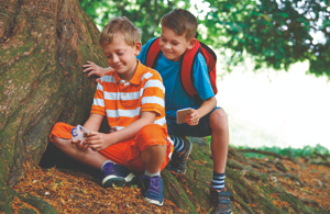 Two kids geocaching