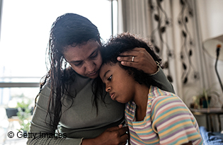 MotherComfortingYoungGirl
